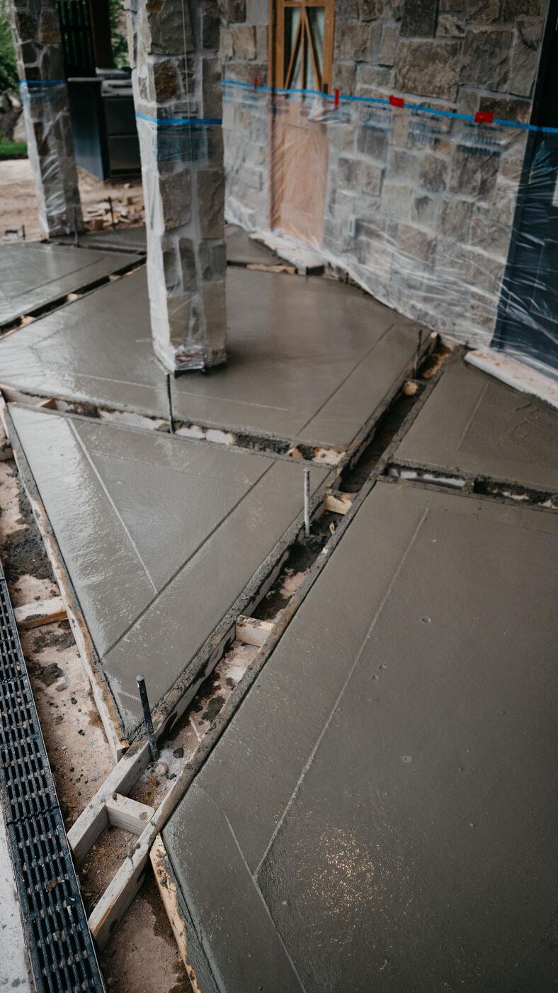 Wet concrete worked in around the base of a stone column
