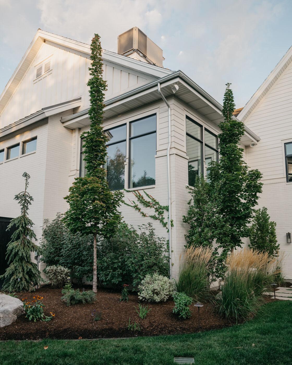 Layered planting wrapping the corner of the house